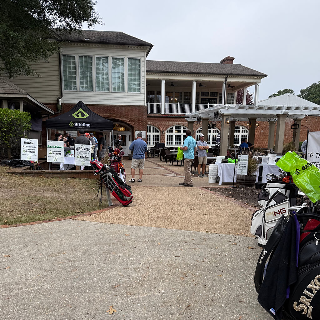 Registration tents and golfers at the 2026 Doug Smith Memorial Siteone Golf Tournament